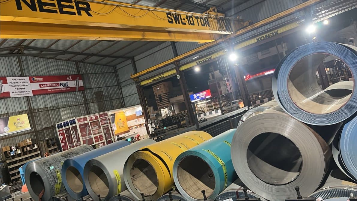 Steel coils inside the warehouse beneath the overhead crane