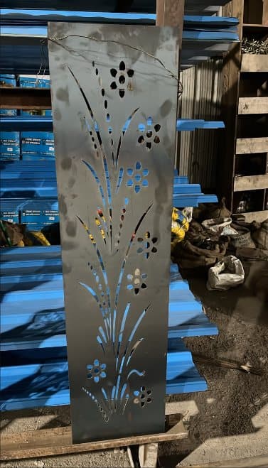 Decorative laser-cut MS sheet panel with colour coated sheets behind